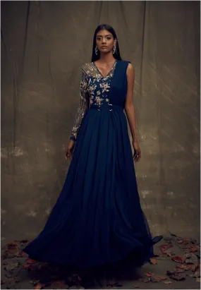 Dark teal blue single sleeved gown with one shoulder georgette drape   pleated net hem   belt