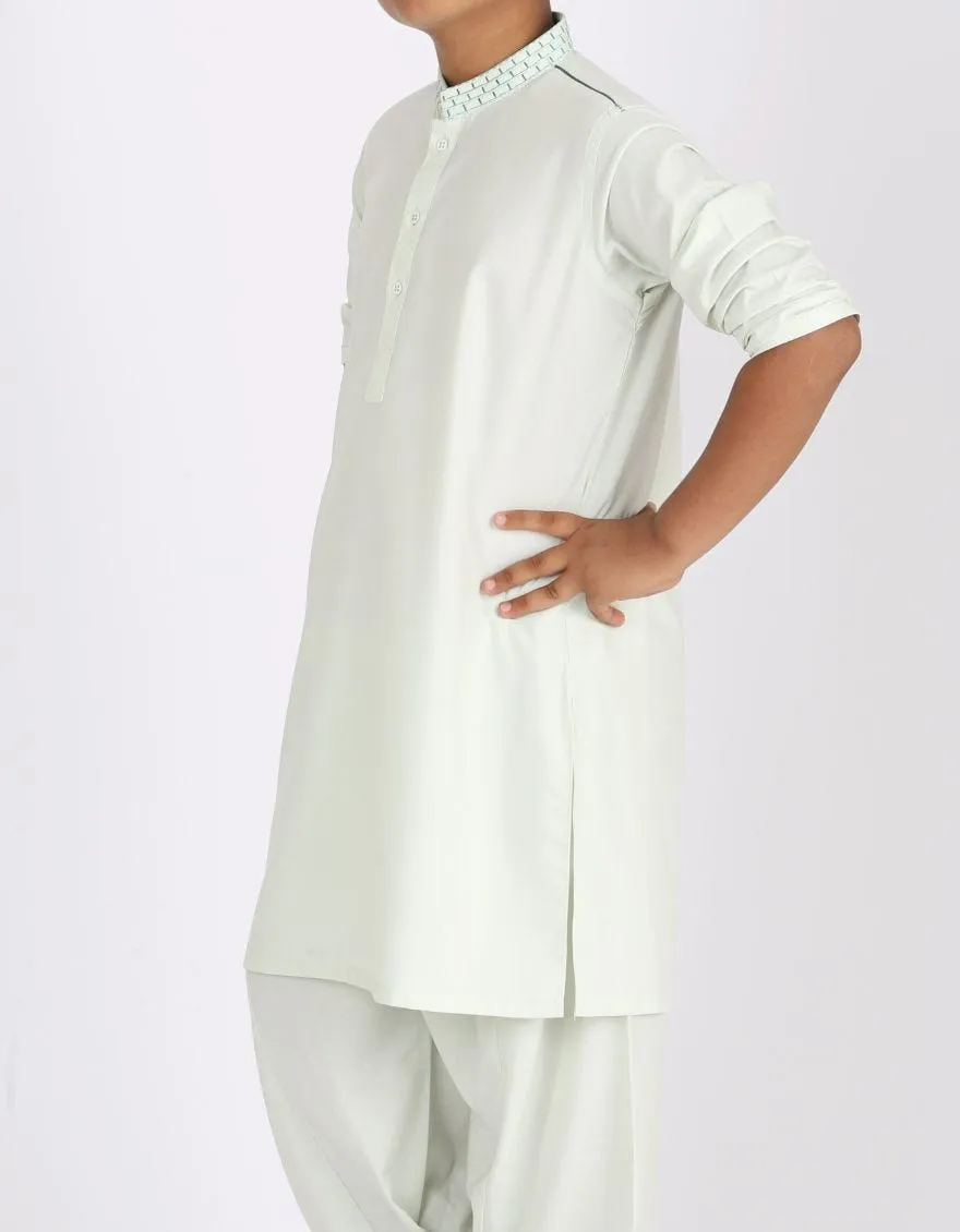 Pakistani machine embroidered dress in light green color # K2313